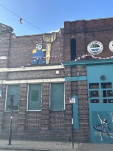 a brick building with a blue door and a blue door