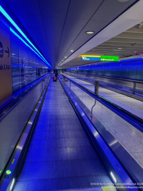 a moving walkway in a airport