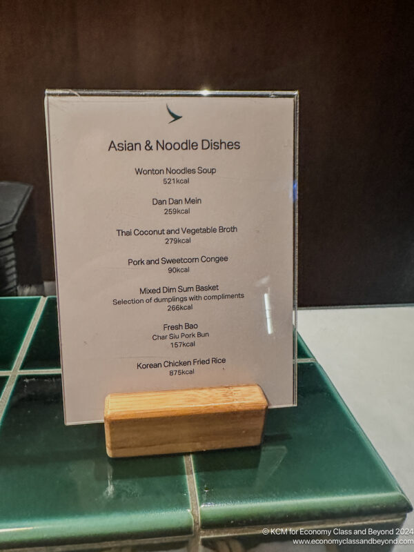 a menu on a green tile surface
