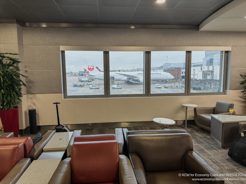 a room with a large window and a couple of airplanes