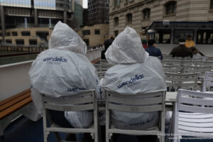 a couple of people wearing plastic bags