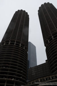 a tall buildings with round balconies