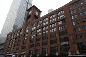 a large brick building with a clock tower