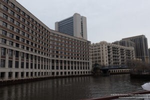 a body of water with buildings in the background