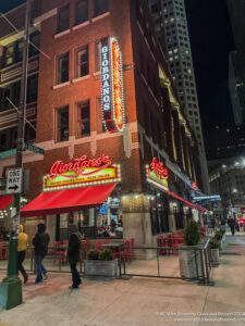 a building with red awnings and neon signs