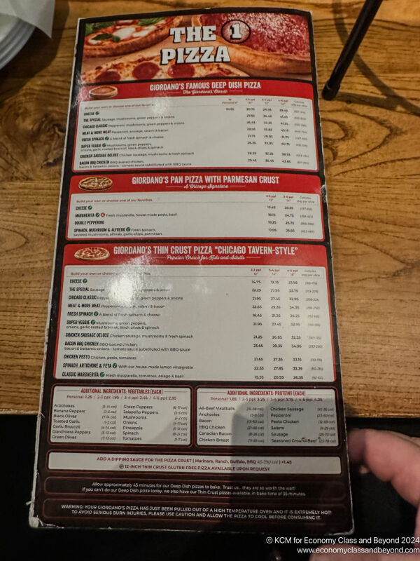 a hand holding a menu