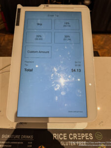 a tablet with a screen showing numbers and prices