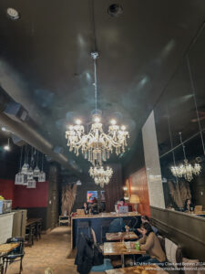 a group of people sitting at tables in a restaurant