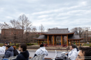 a group of people sitting in chairs outside a building