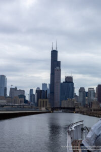 a city skyline with a bridge over water