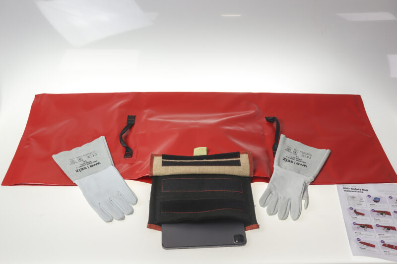 a red bag with gloves and a tablet