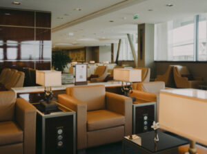 a lounge area with chairs and tables