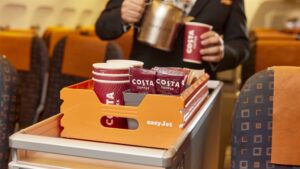 a person pouring coffee into a container