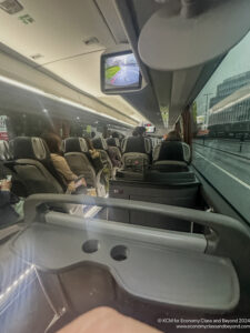 a group of people sitting in a bus