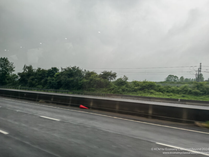 a road with a red cone on it