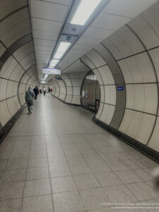 a group of people walking in a tunnel