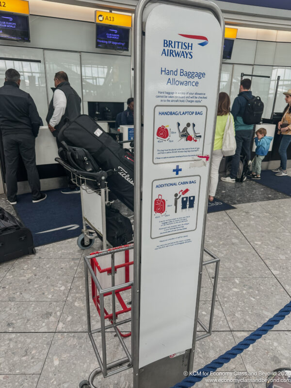 a sign with luggage on it