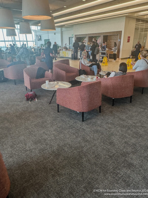 people sitting in chairs in a room