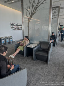 people sitting in chairs in a waiting room