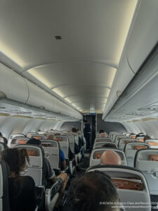 a group of people sitting in an airplane