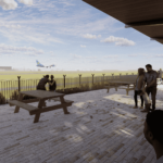 people standing on a brick patio with a plane flying in the background