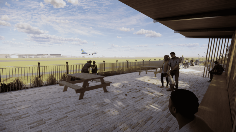 people standing on a brick patio with a plane flying in the background