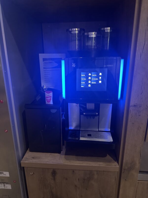 a coffee machine with a blue light