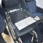 a wheelchair with a laptop on it