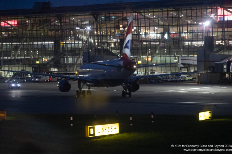 an airplane on the runway at night