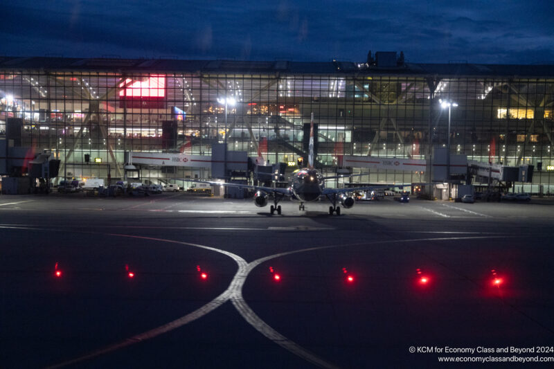 an airplane on the runway at night