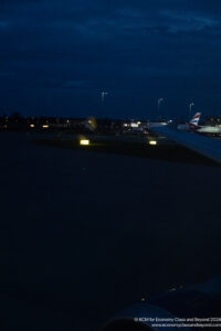 an airplane on the runway at night