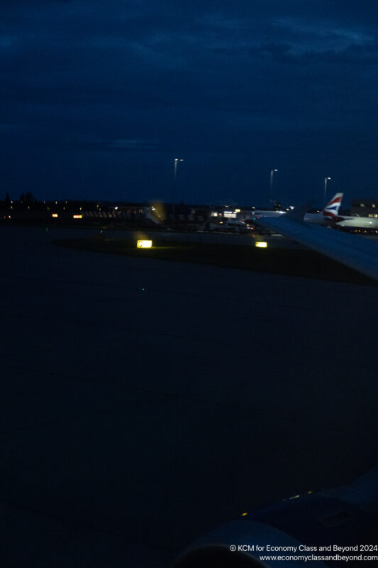 an airplane on the runway at night