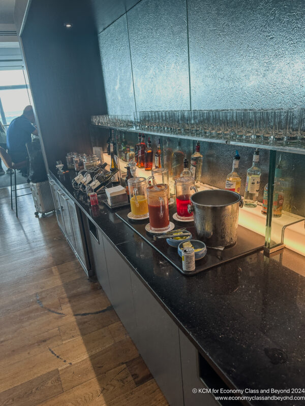 a bar with many glasses and bottles