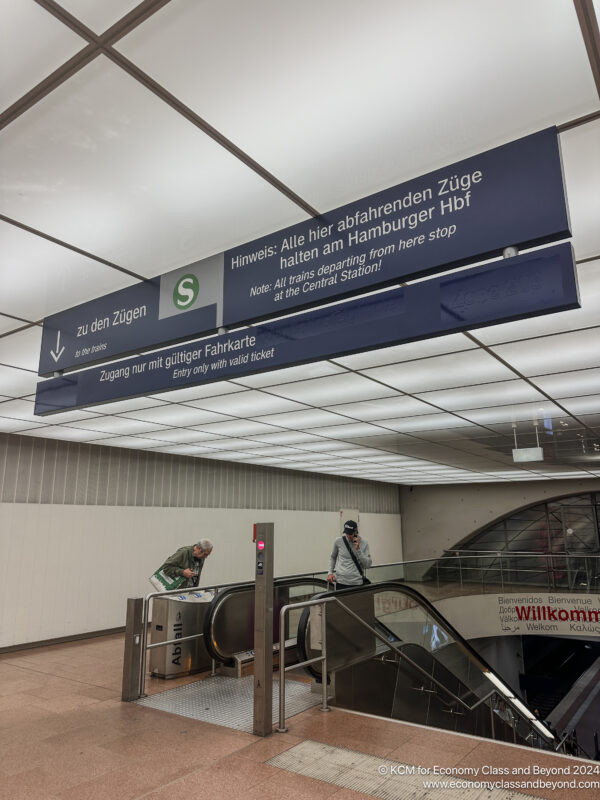 a man standing on an escalator