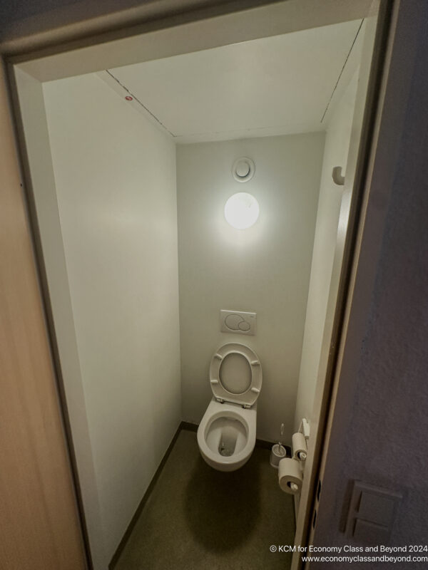 a toilet in a small bathroom