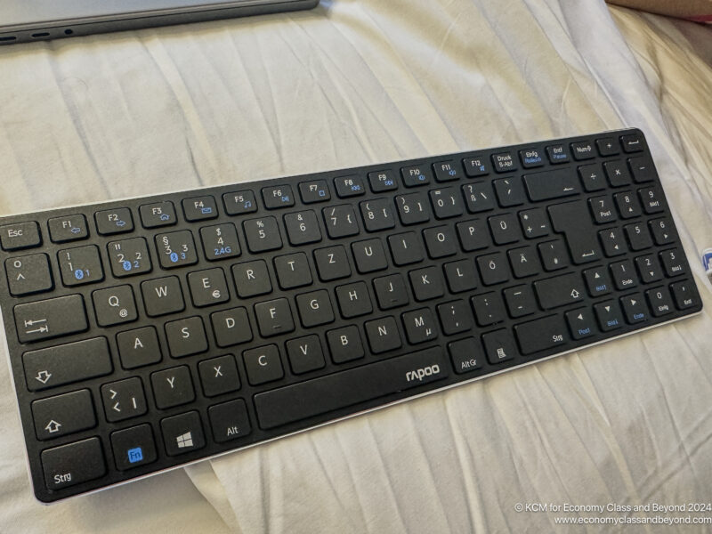 a black keyboard on a white sheet