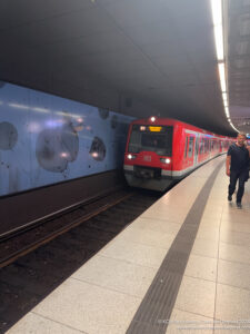 a man walking next to a train