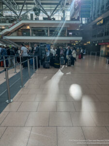 a group of people with luggage in a terminal