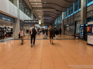 a group of people walking in a large airport