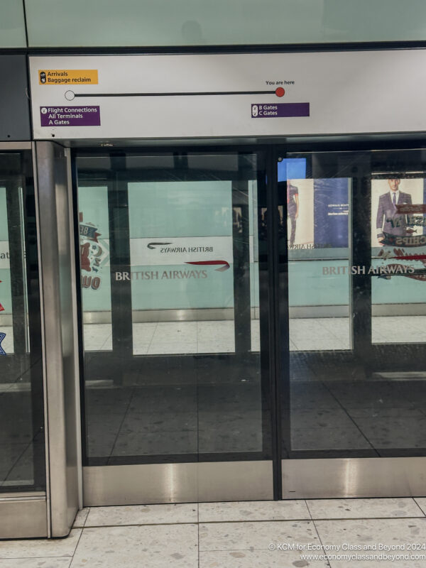 a glass doors with signs on them