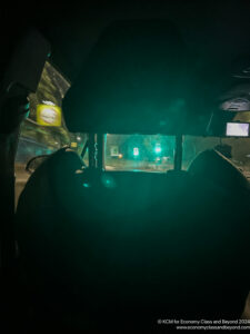 a view from inside of a car at night