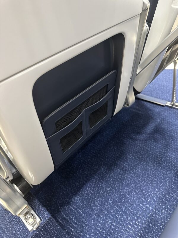 a seat with a pocket on the side