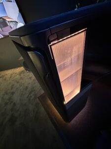 a black rectangular object with a light on it