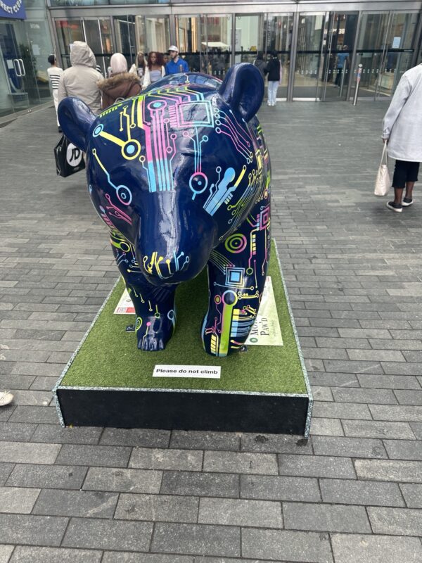 a statue of a bear on a platform