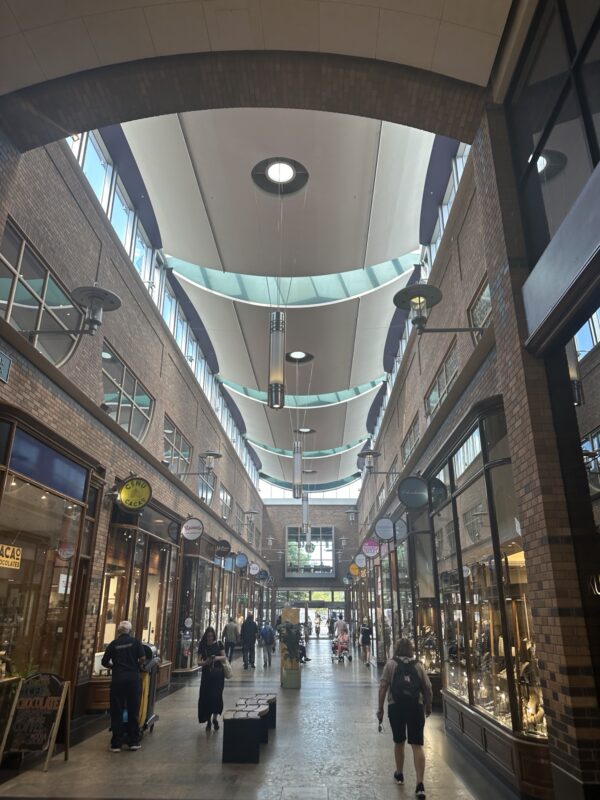 a group of people walking in a mall