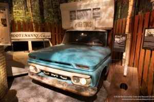 a blue truck parked in a shed