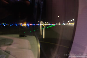 a view of a street from a window at night