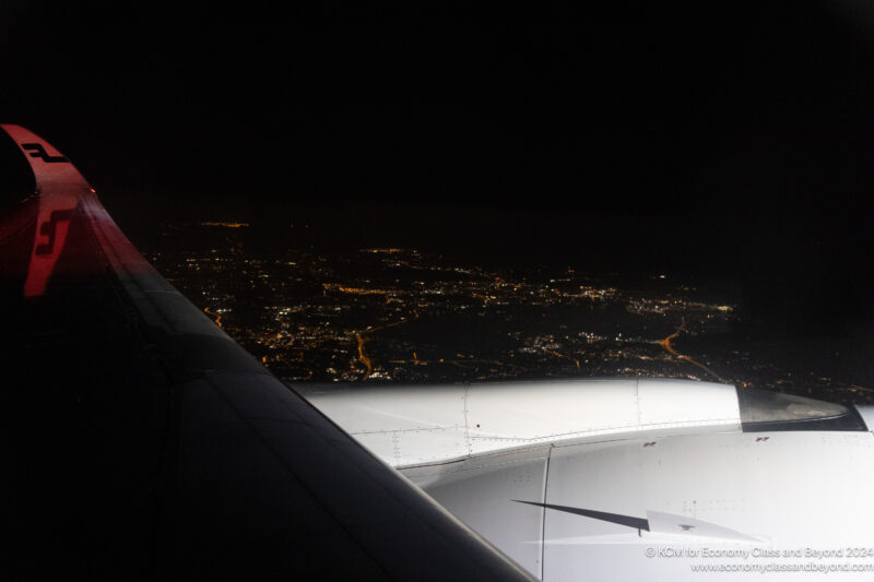 an airplane wing and wing of an airplane at night