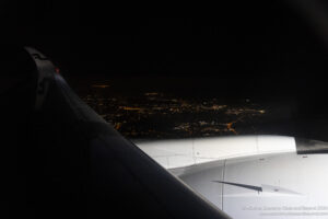 an airplane wing and wing of an airplane at night