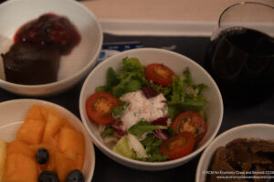 a bowl of salad and fruit
